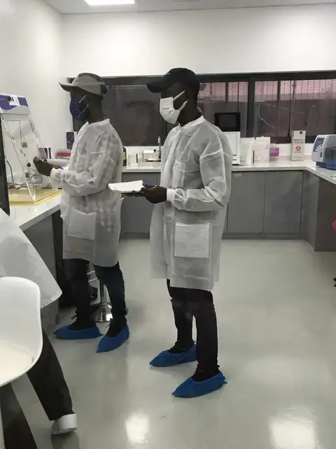 Engineers carrying out a power audit in a laboratory