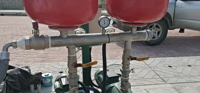 Pressure vessels and pipework for a water booster pump set