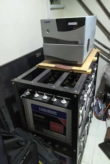 Inverter sitting on a rack above a tubular battery