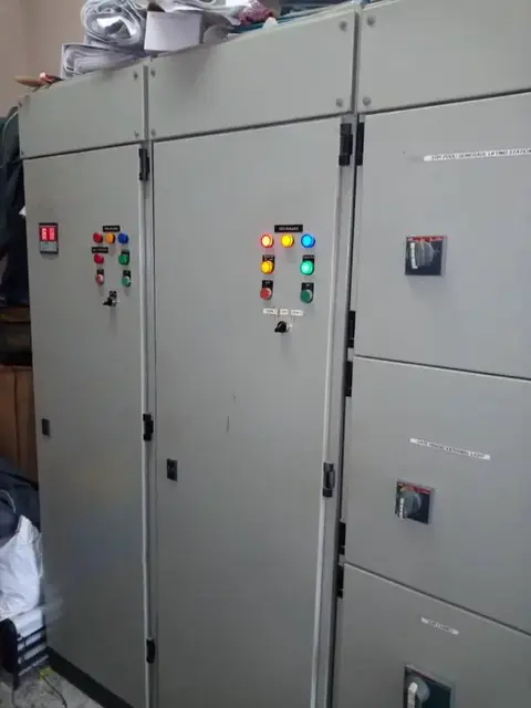 Grey floor-standing control panels with indicator lights