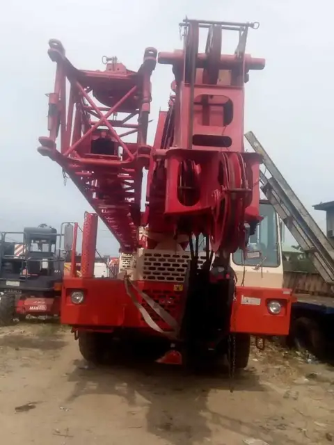 Red mobile crane on a construction site