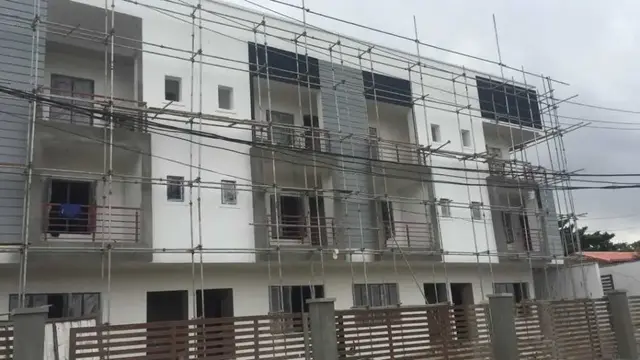 Terrace houses with scaffolding nearing completion